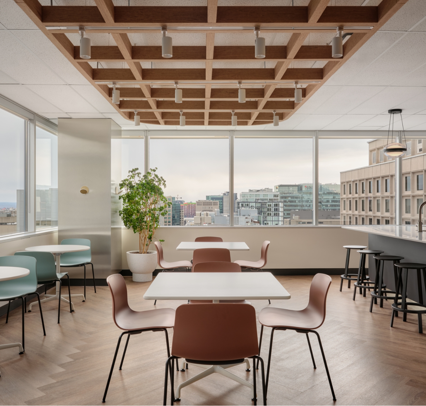 Contemporary office space with wooden beams and seating, showcasing JP Gravel Tenant Fit-ups