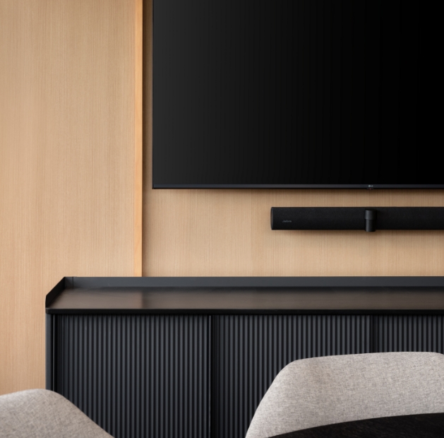 Modern living room featuring a wall-mounted TV, showcasing sleek design elements by JPG Millwork.